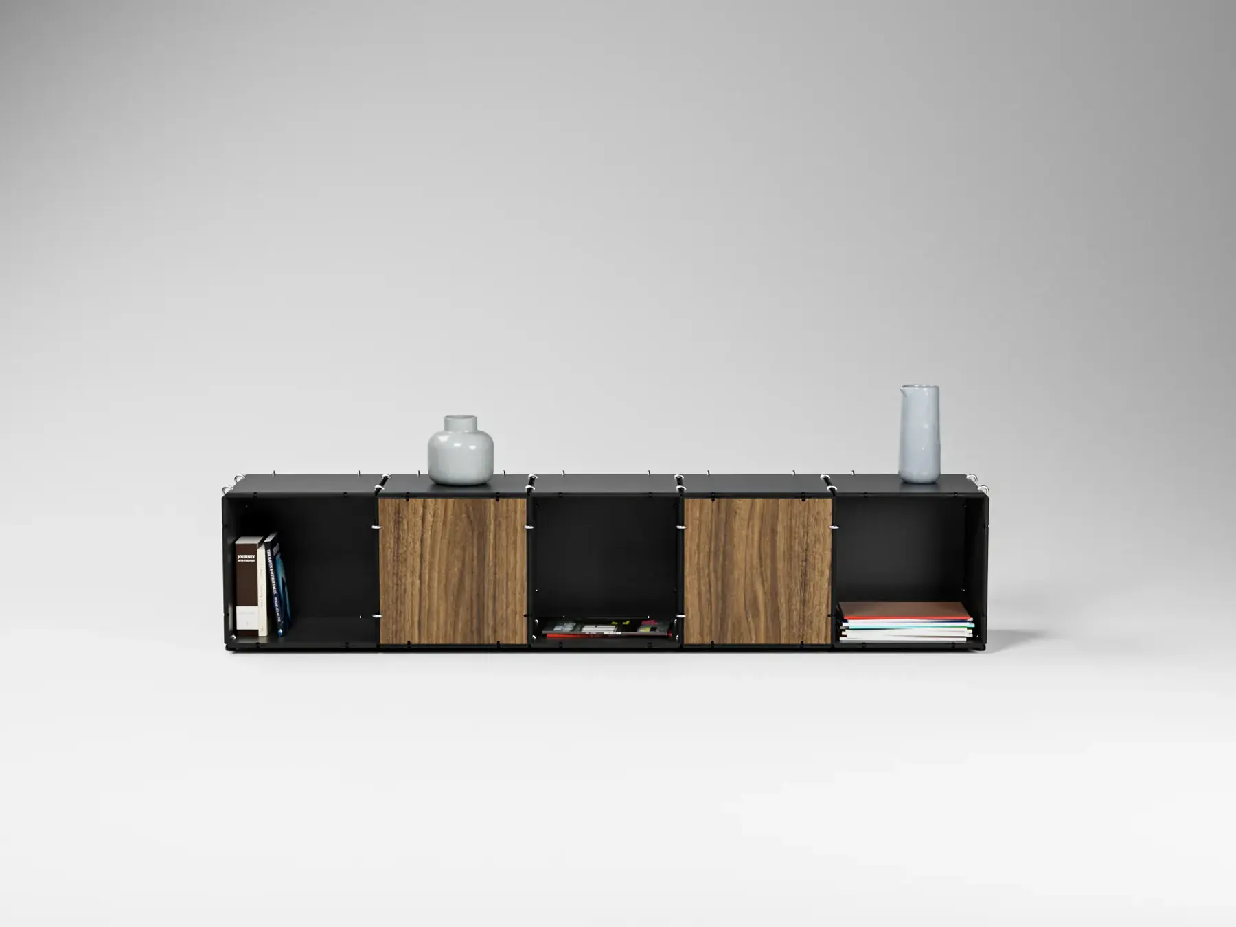 Low Anillo lowboard in black with walnut fronts